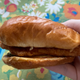 Popeye's flounder sandwich on floral background